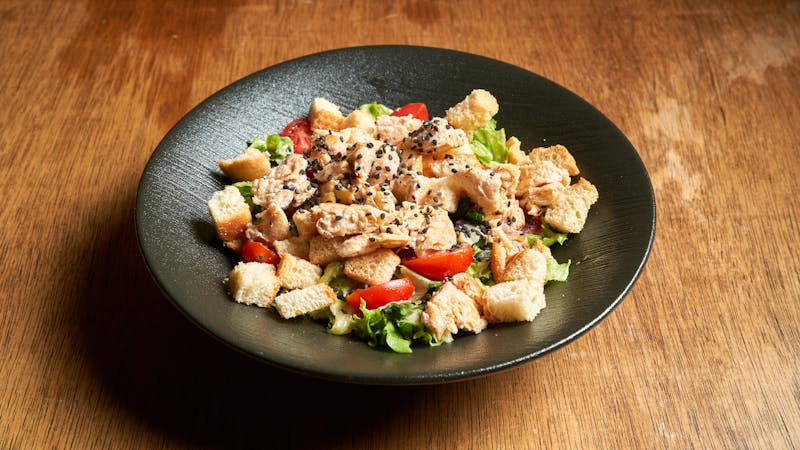 Fresh Caesar salad with croutons at Marcos