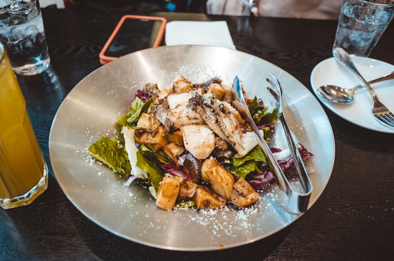 Grilled chicken salad with avocado and mixed greens